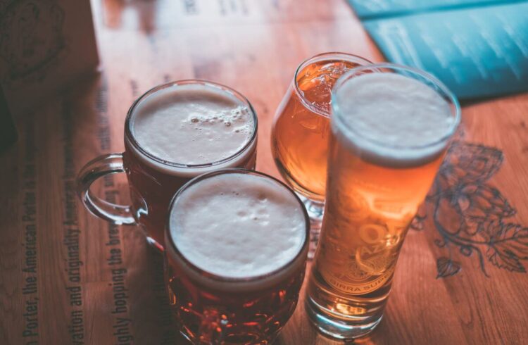 Four beers on a table