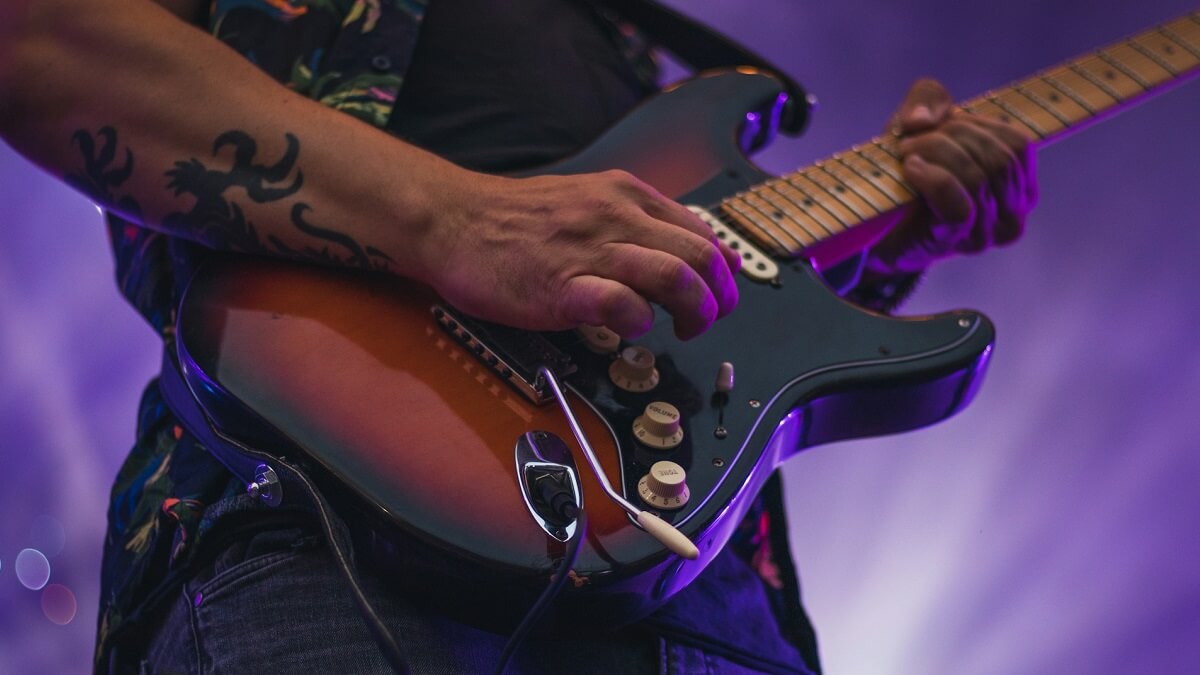 A musician playing an electric guitar